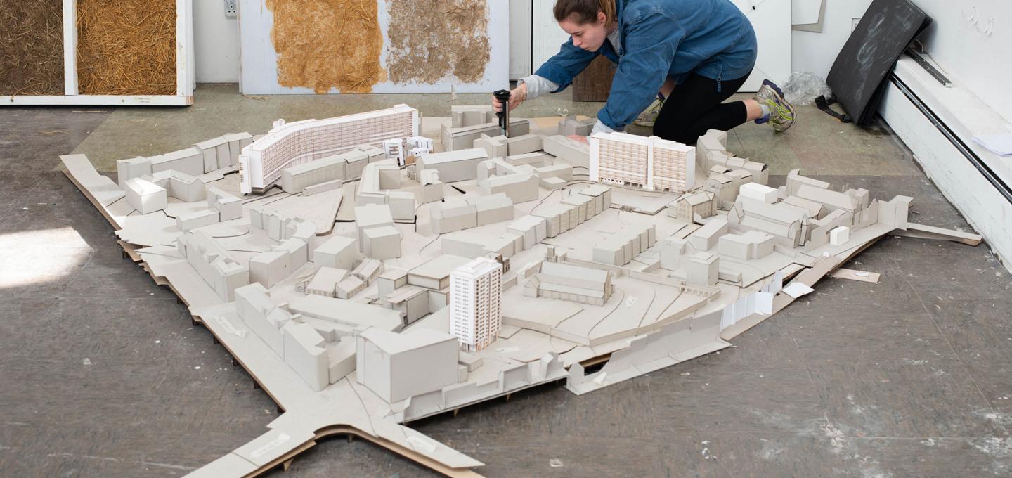 A student works on an architectural model in the ESALA studios.