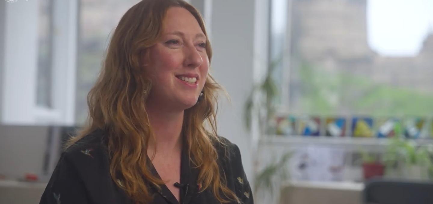 Lecturer Rachel Harkness sits in a classroom to talk about the Design for Change programme.