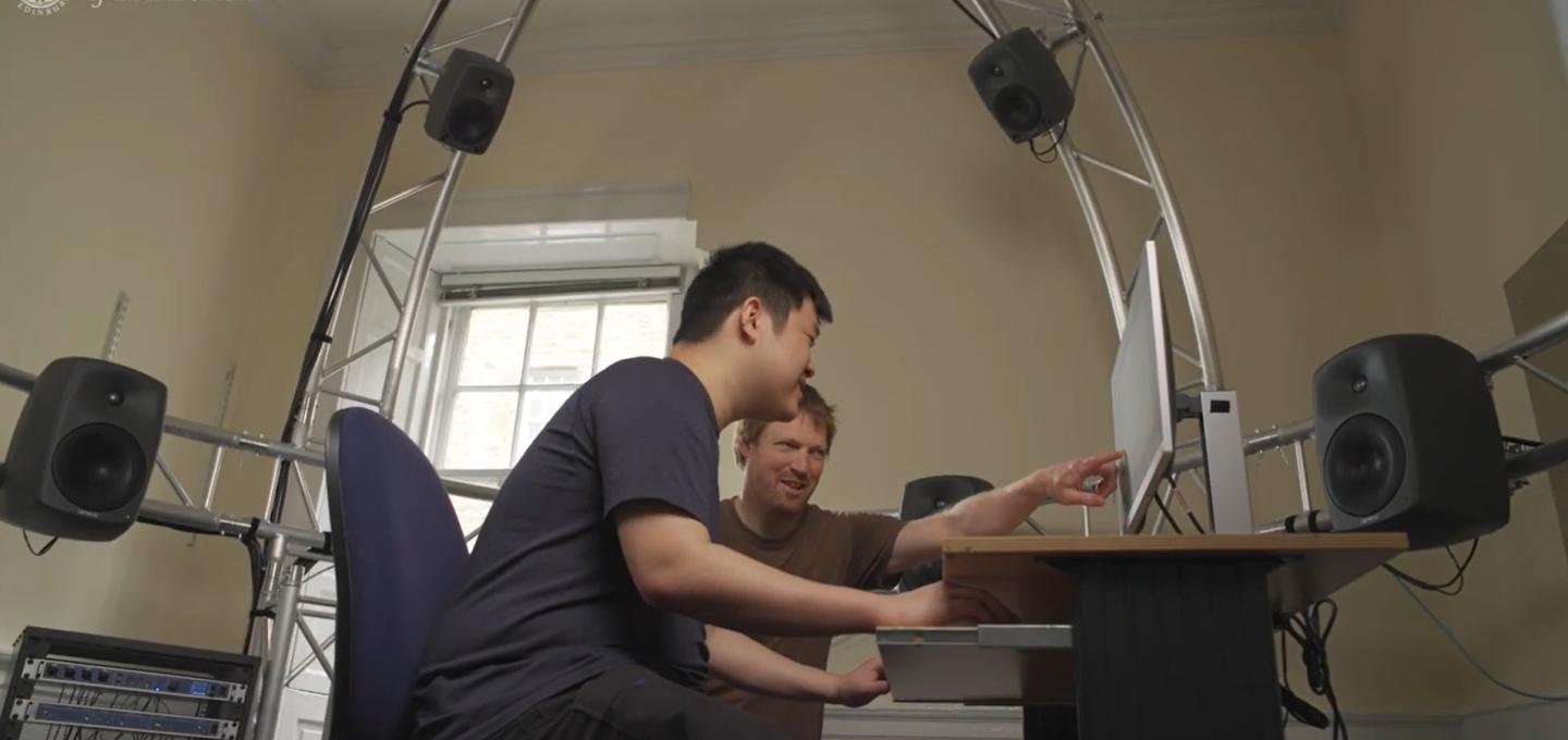 Programme Director Tom Mudd, talks to a student on the Acoustics and Music Technology programme.