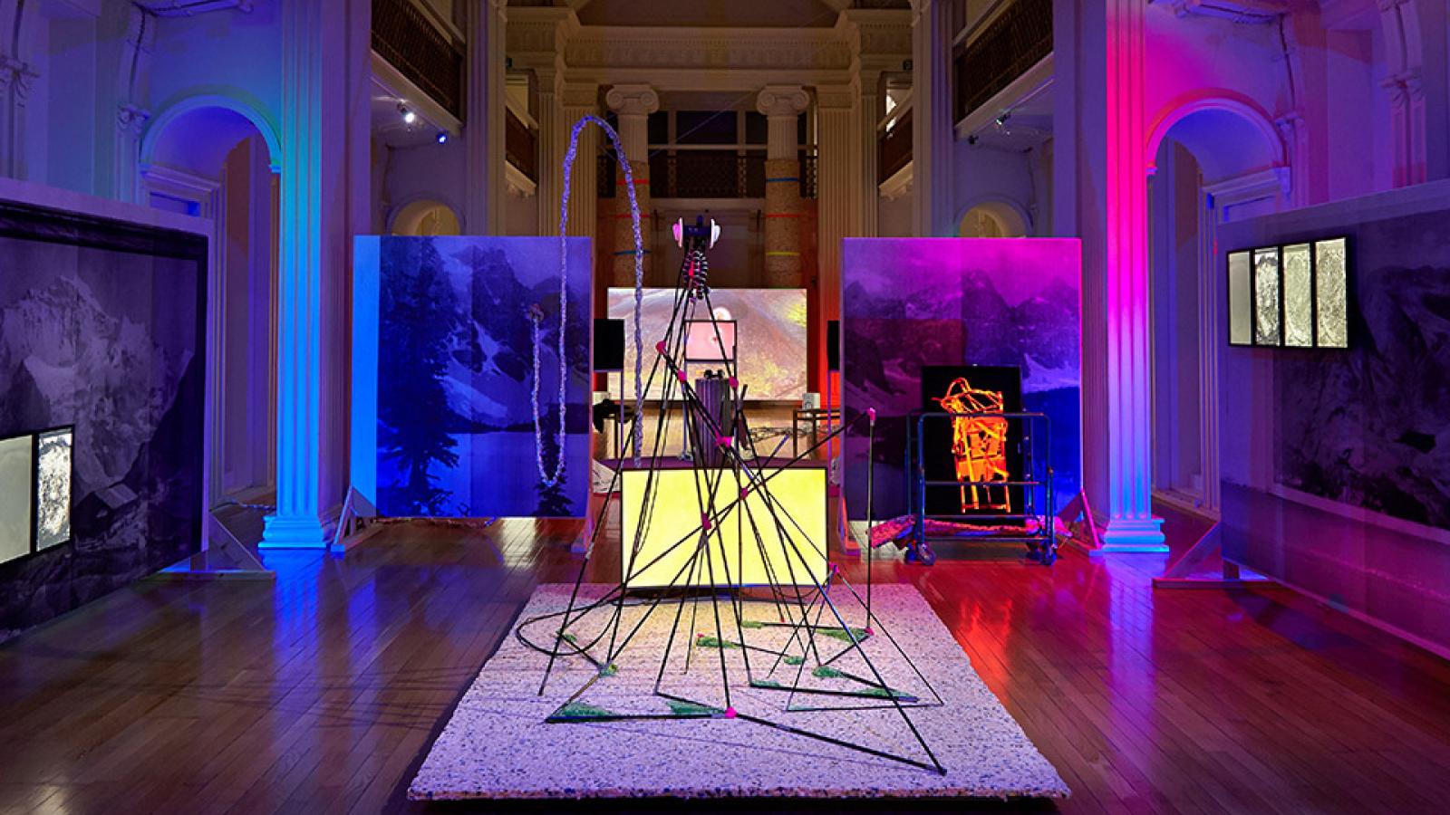 Internal of Talbot Rice Gallery during an exhibition, with a sculptural work featuring lights and metallic shapes