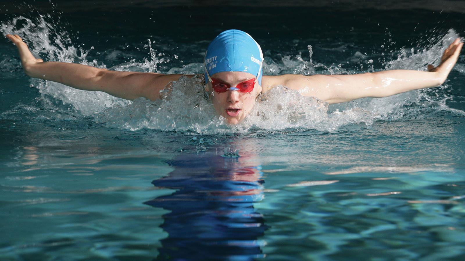 A person pictured mid swim