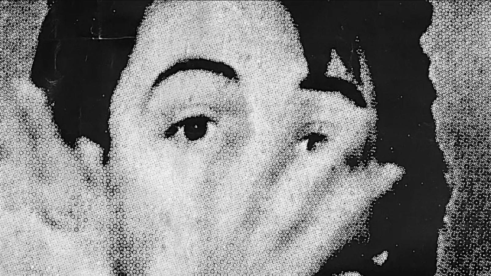 A black and white close up photo of Paul McCartney's face by artist John Smith.