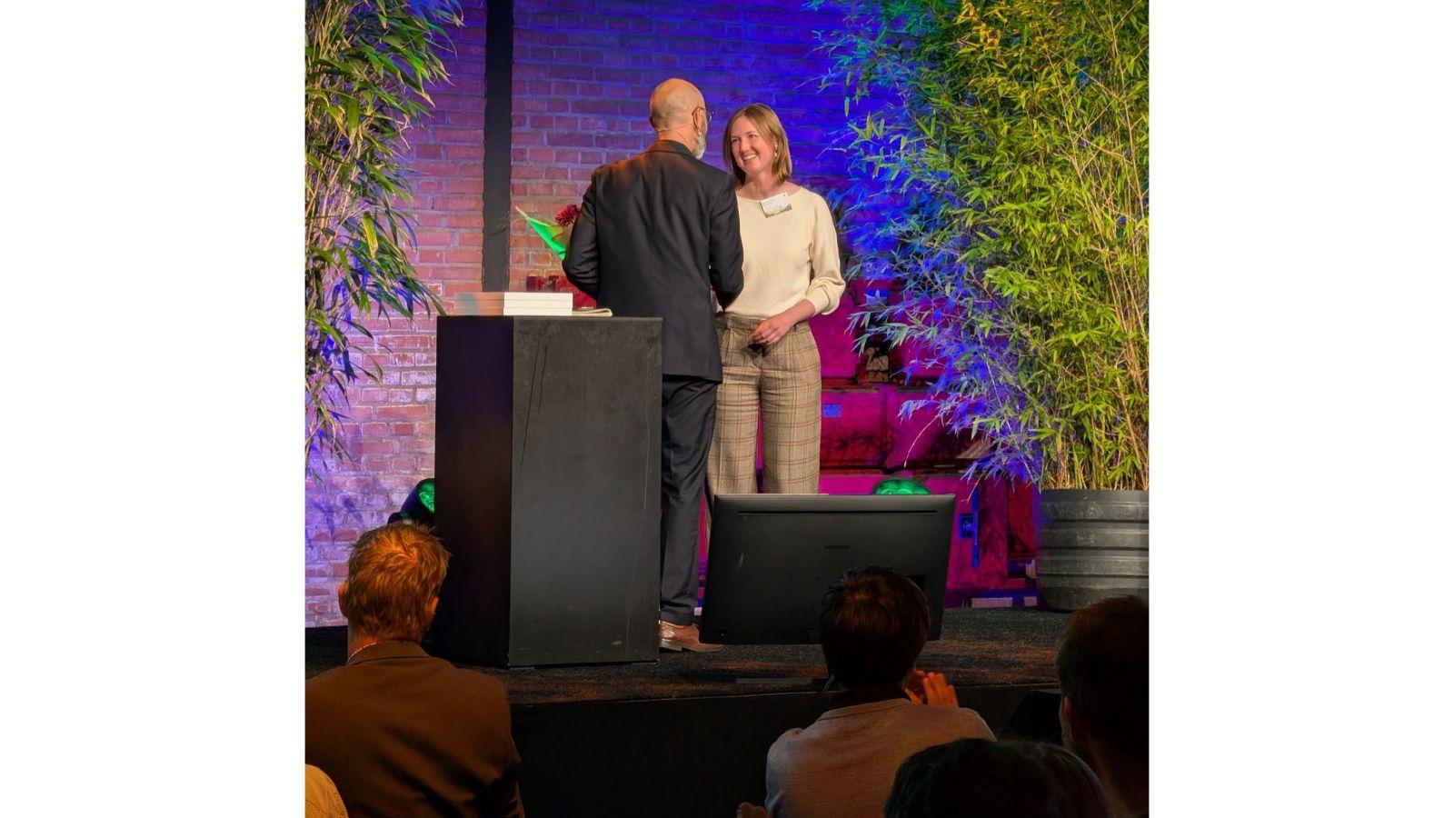 Jillian receives her award on stage