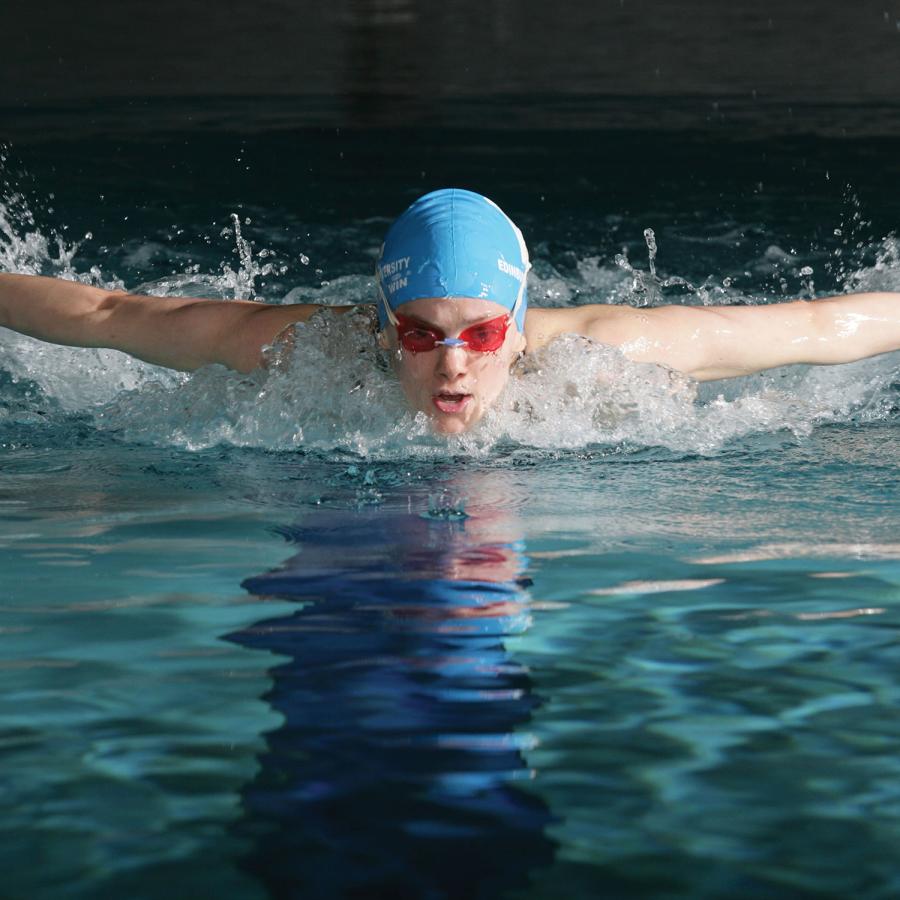A person pictured mid swim