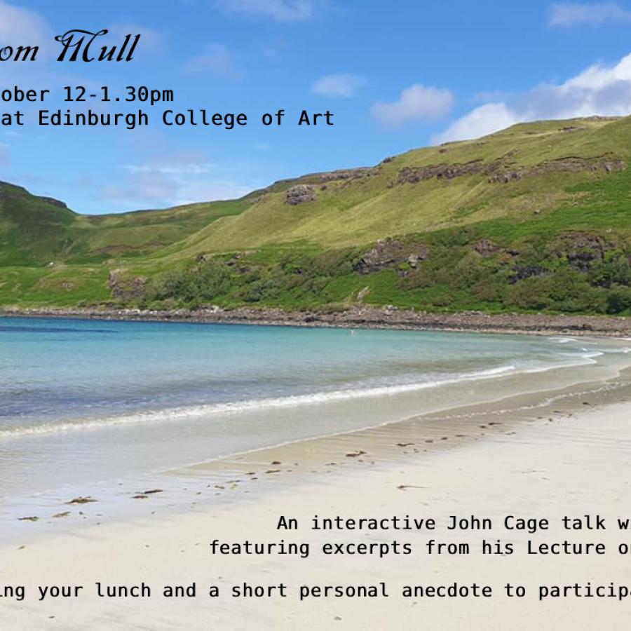 A view of a beach on the Isle of Mull. Clear blue waters lap at the white sandy beach, with a lush green hill in the background.