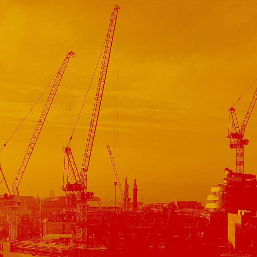 A view of the Edinburgh skyline coloured in orange and red. Four cranes and the walnut whip shape of the W hotel can be seen above the roof tops.