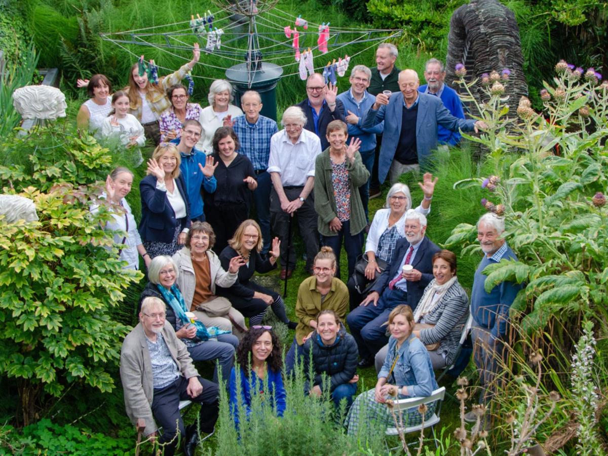 A group of alumni and staff from the Masters of Landscape Architecture programme standing in a garden