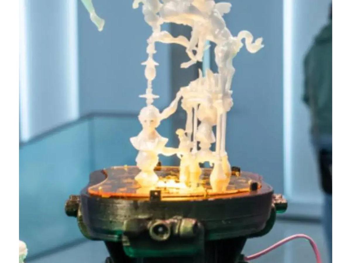 An AI-generated 3D print. It is white, includes human heads, animal parts, and other shapes, lit from below.