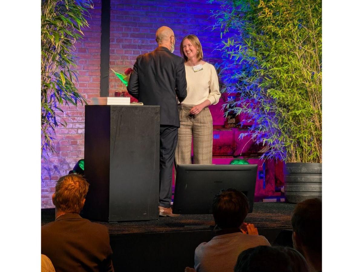 Jillian receives her award on stage