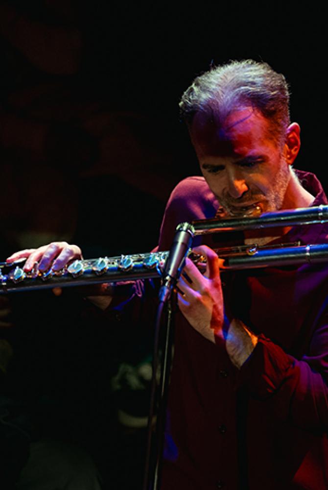 Dr Richard Craig playing the flute.
