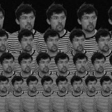 A black and white image of a person in a stripey top and wearing glasses. They're looking to their left and this image is repeated over several rows, each one getting smaller as they descend.