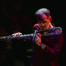 Dr Richard Craig playing the flute.