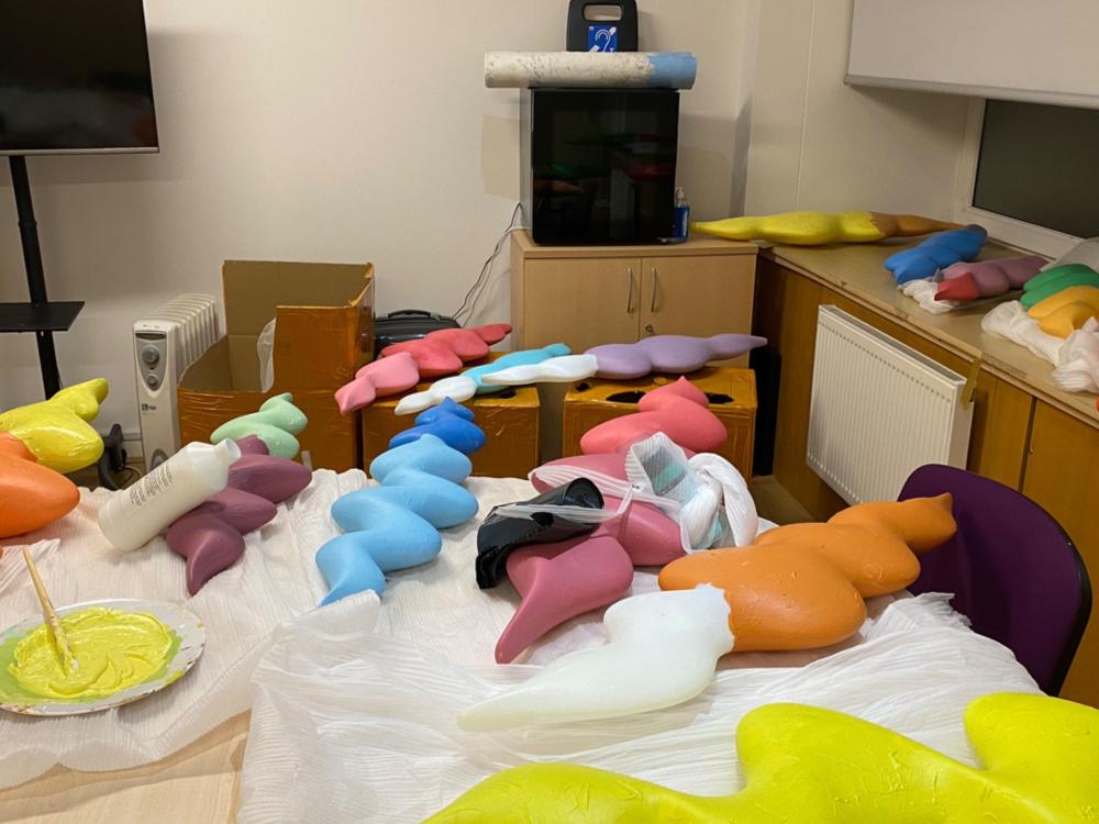 A photo of the soundwave-inspired artworks in a studio environment.