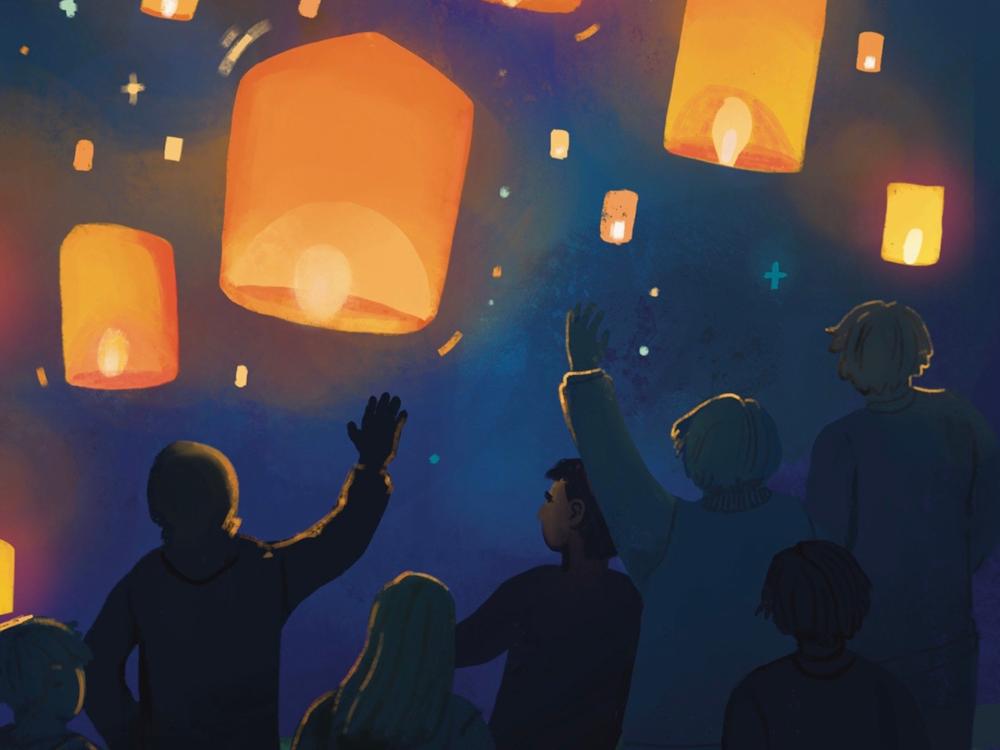 Full colour illustration - a group of people let off lit paper lanterns at night