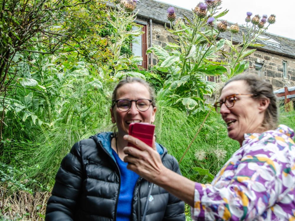 Two people looking at a phone