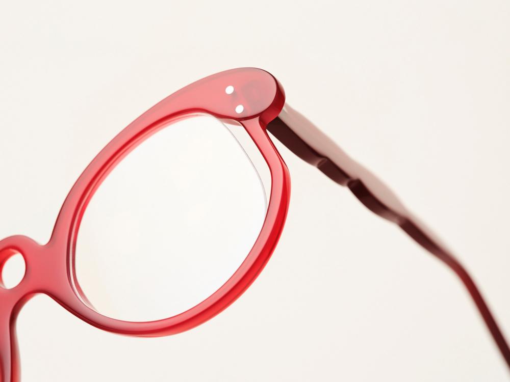 A close up of one lense of Holly's glasses design against a white background.