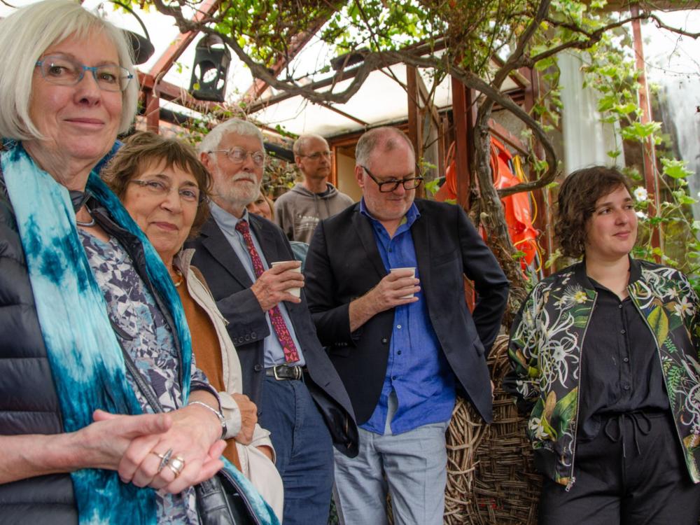 Party guests gathered at John Byrom's garden party.