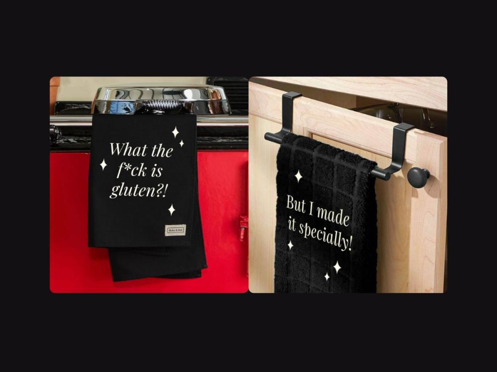 Two photographs - in the left, a black tea towel hangs from the rail of an Aga. White text on the tea towel reads 'What the f*ck is gluen?!.  In the right image, a black towel hangs from a rail on a kitchen cupboard door. White text on the towel reads 'But I made it specially!'