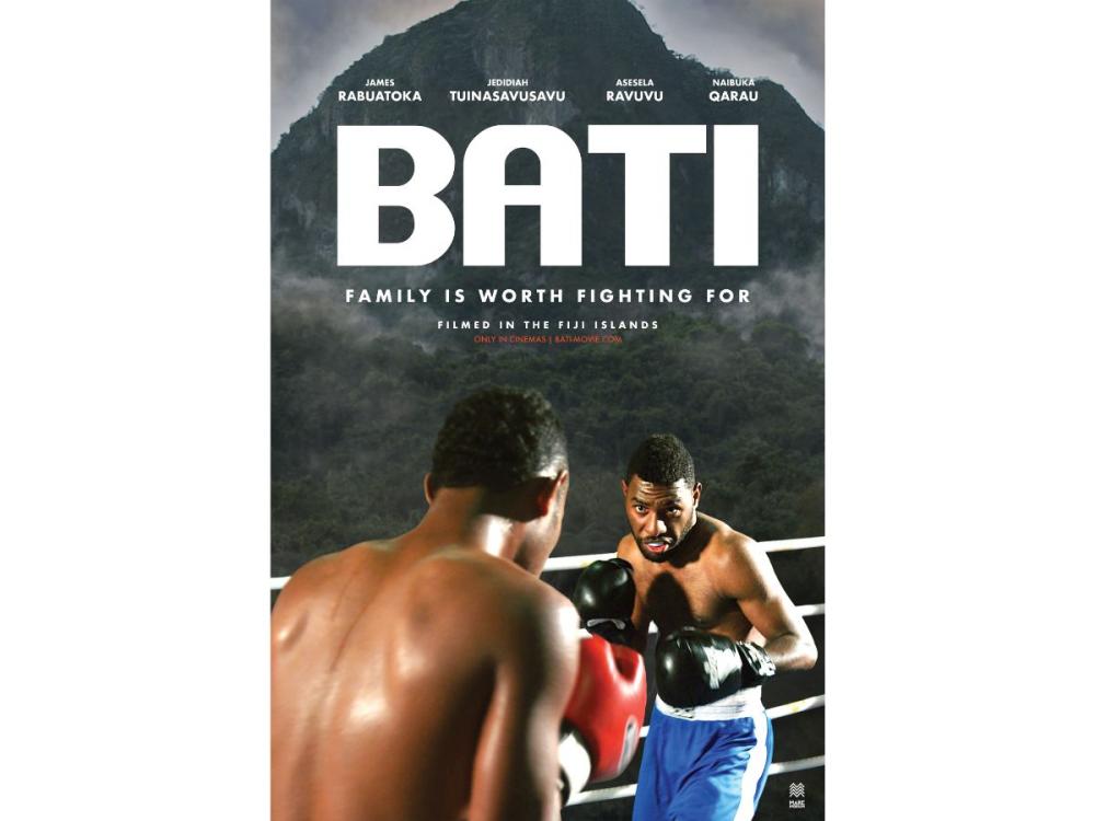 A film poster featuring a photograph of two men about to box, with a green mountain towering behind them.