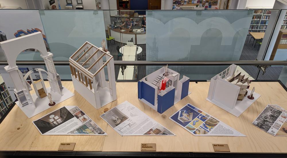 plinth with models in a public library