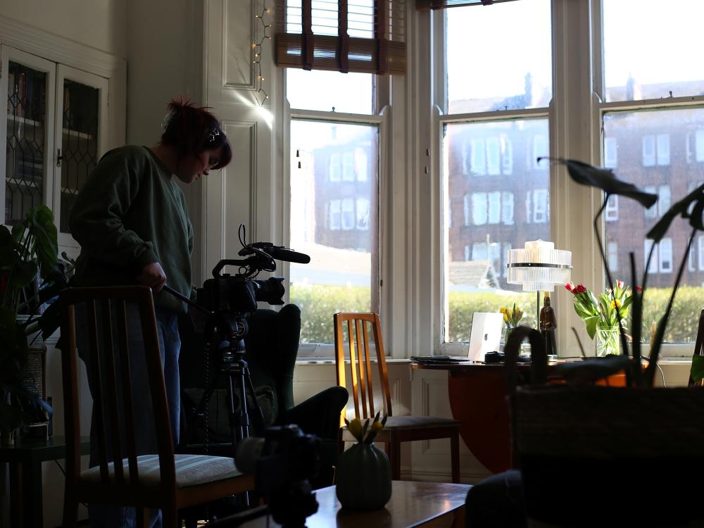 Student filming indoors at a contributor’s place