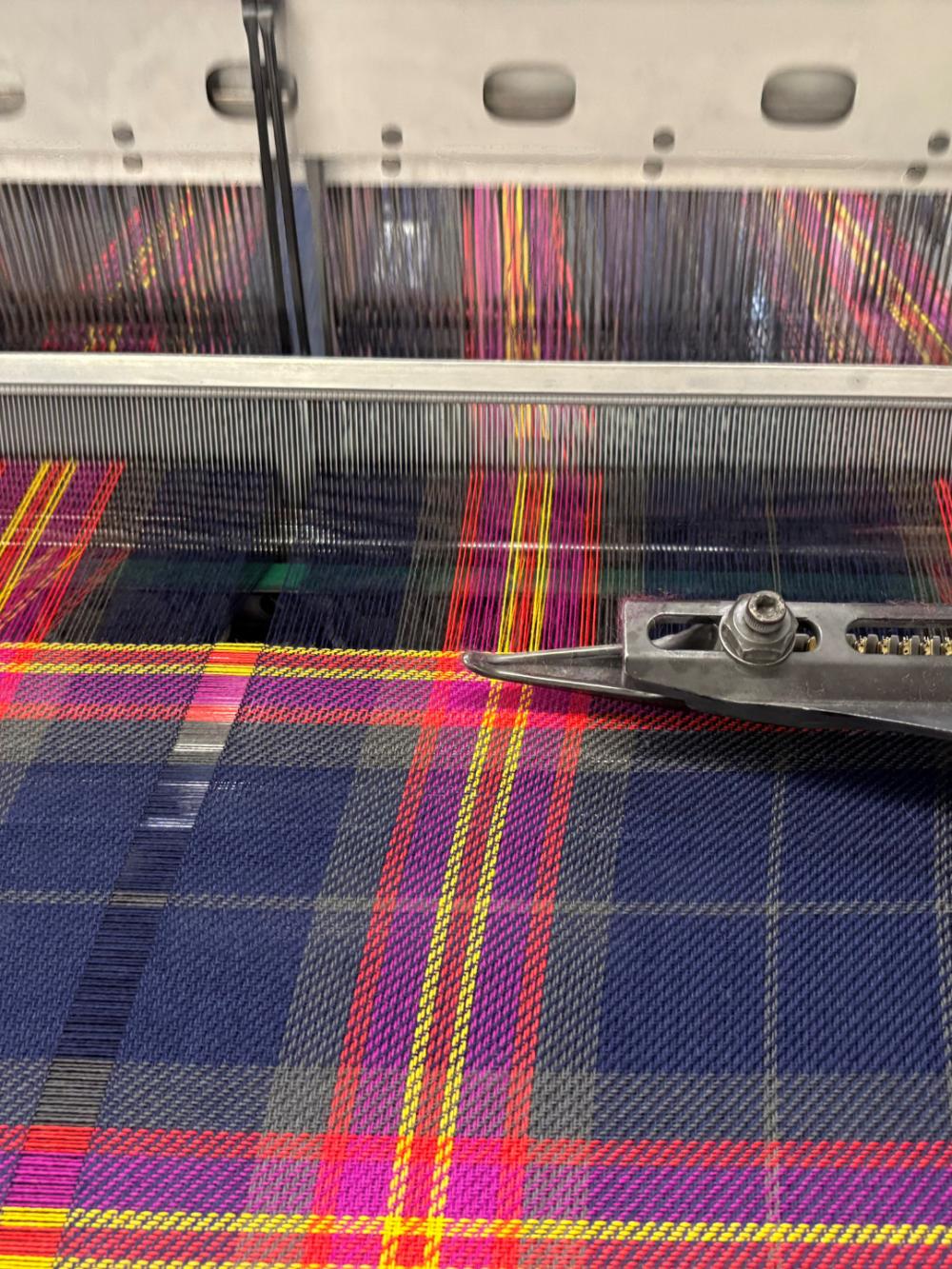 The tartan being woven