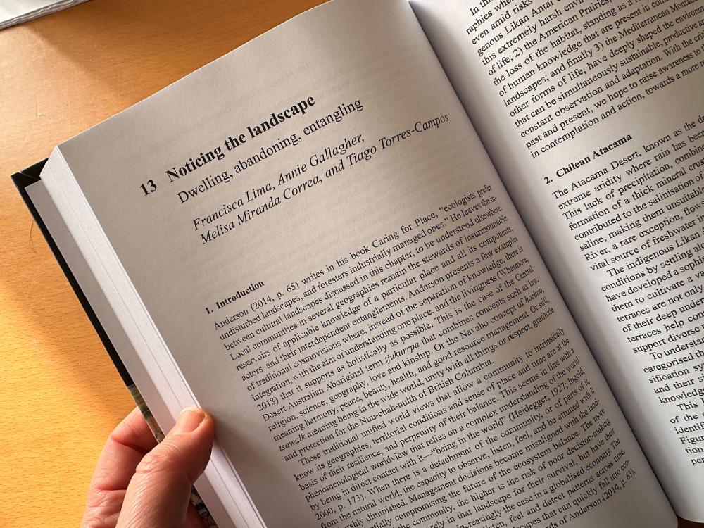 A book open at a chapter titled 'Noticing the landscape'.