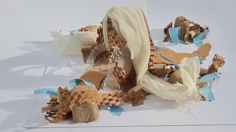 an exploratory model in interior design, made with paper, fabric, cork and other materials.