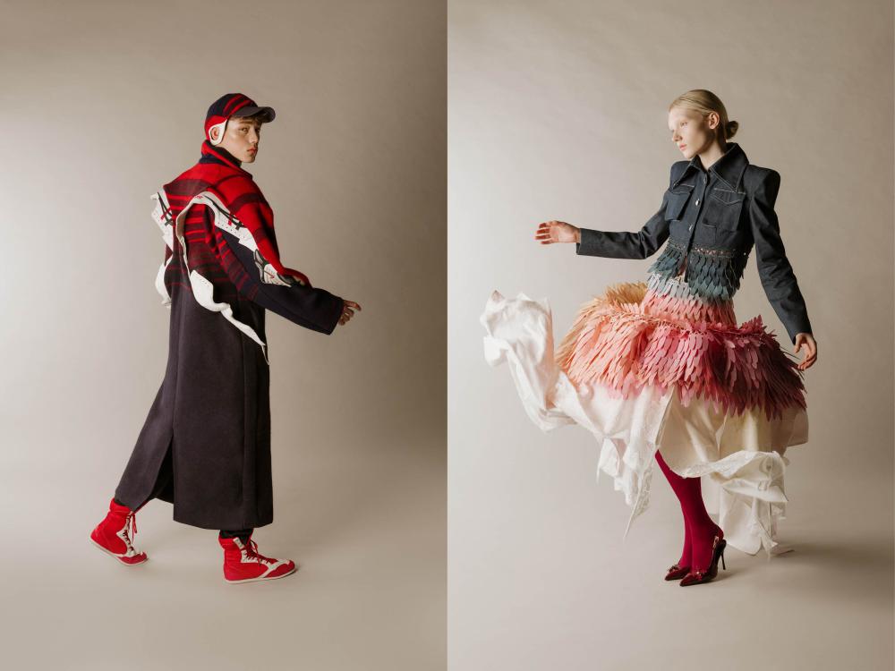 a male model and a female model in high fashion pieces created by ECA students