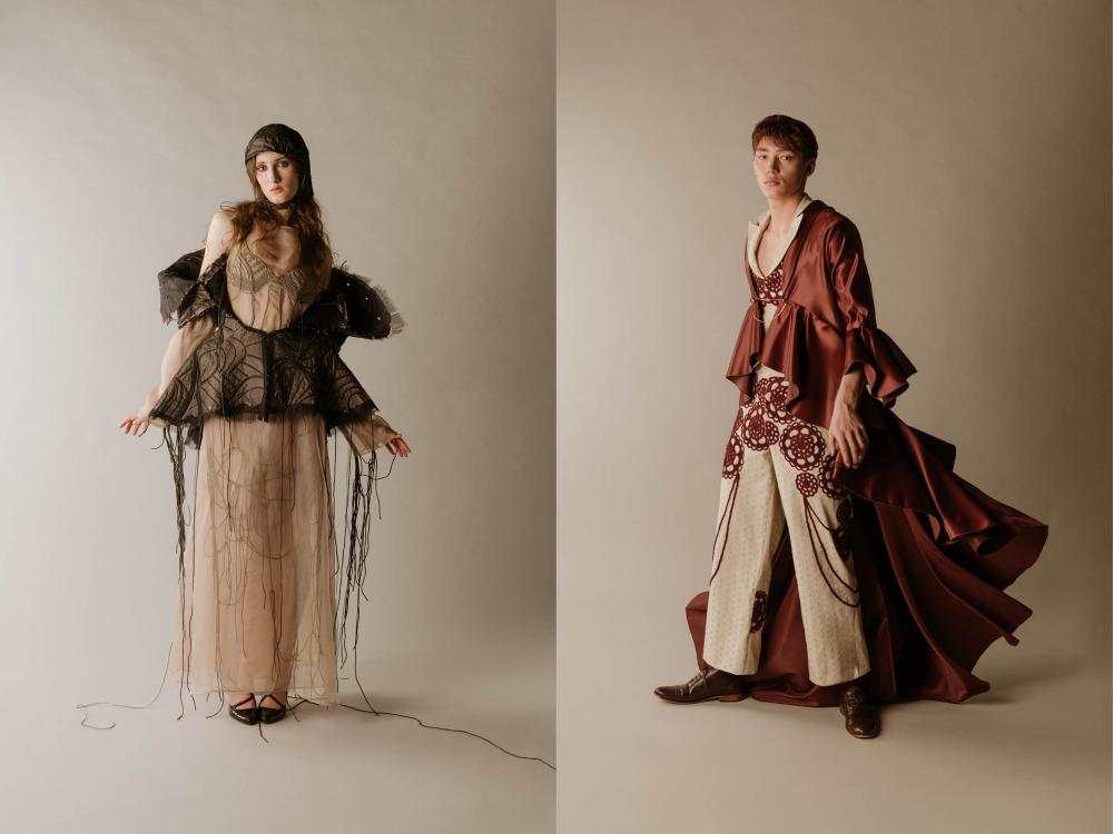 a female model and a male model in high fashion pieces created by ECA students