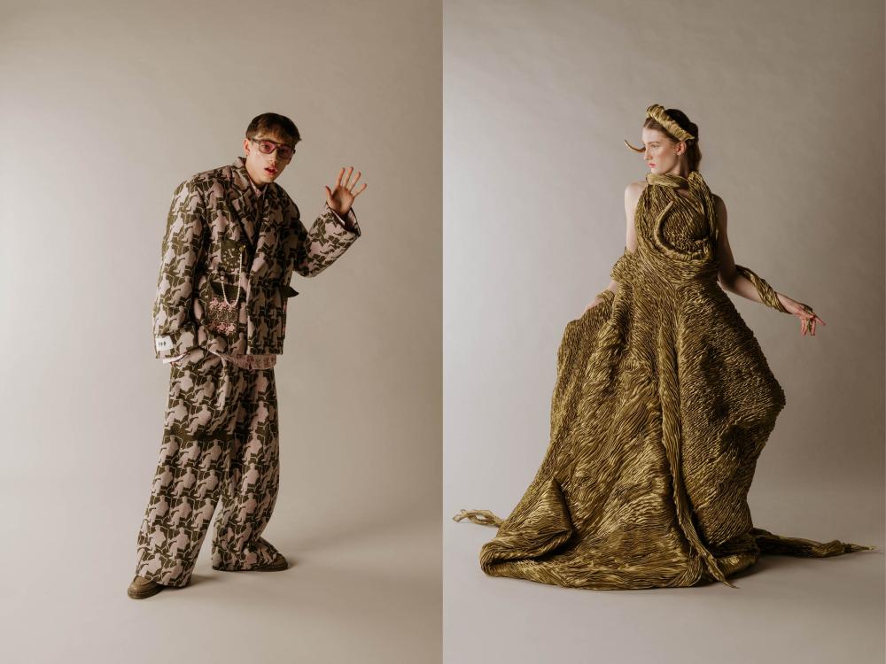 a male model and a female model in high fashion pieces created by ECA students