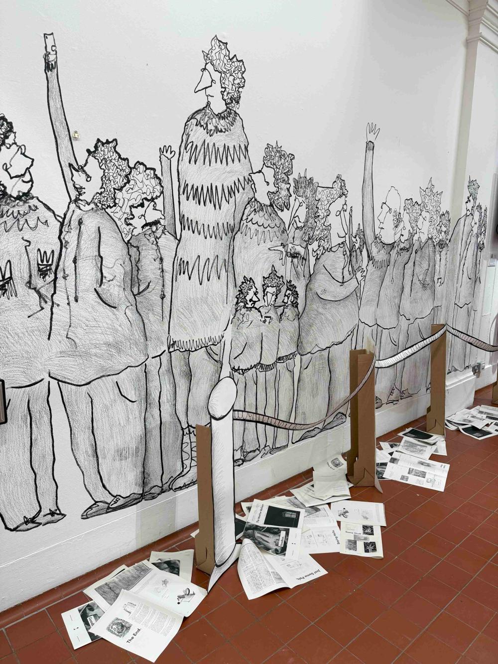 A photograph of a wall with monochrome lifesize drawings of people in a queue in a funny style.