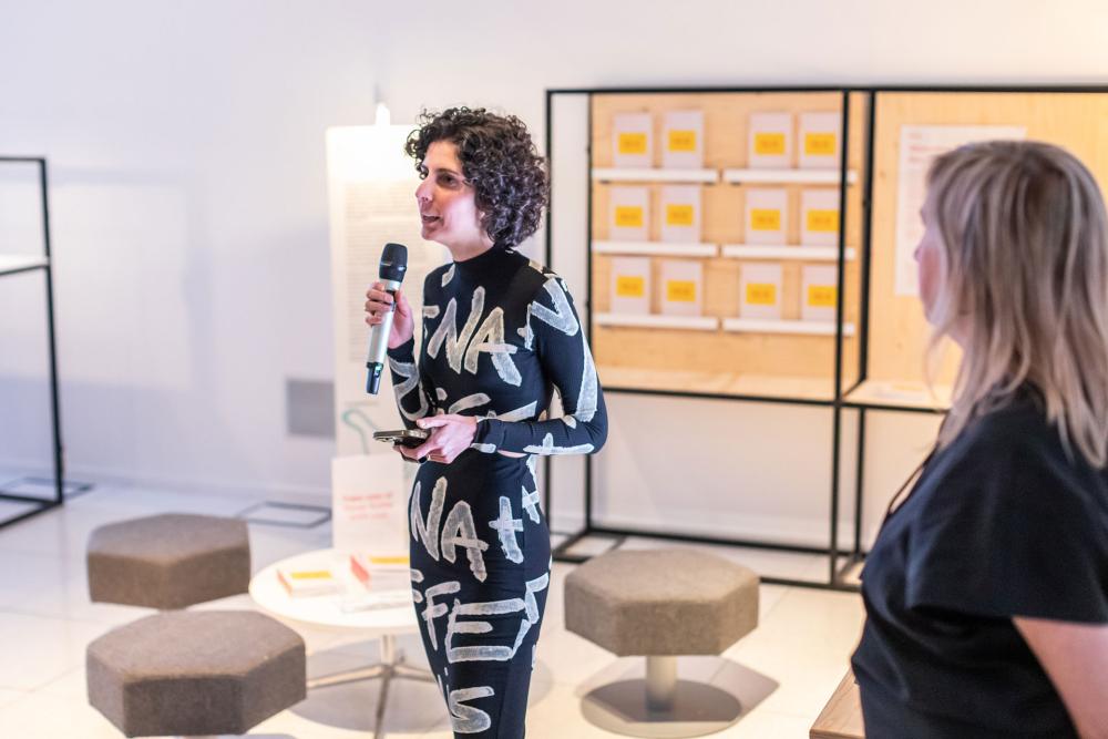 Caterina Moruzzi speaking at the Authenticity Unmasked: Unveiling AI-Driven Realities Through Art exhibition.