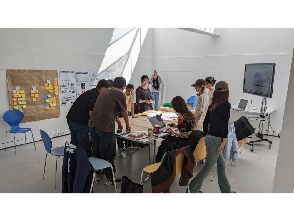 Students in discussion around a table 