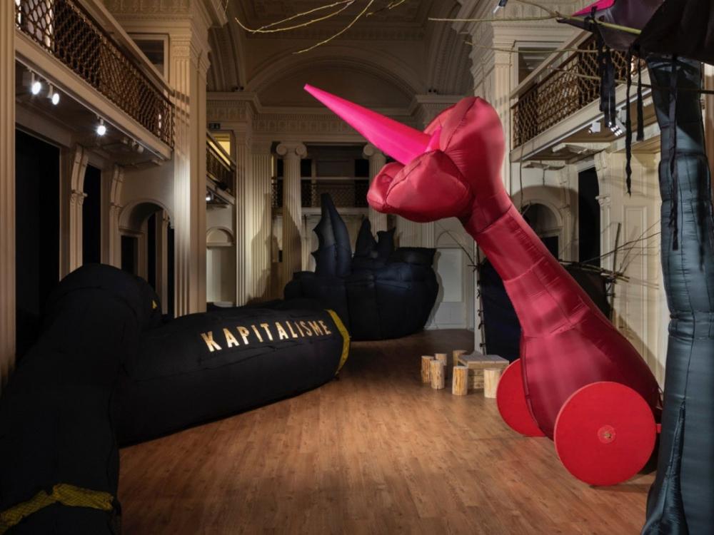 A gallery installation with large colourful blow-up sculptures.