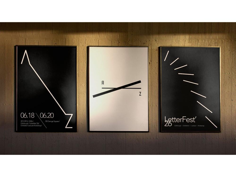 Three framed posters hung on a warm, uplit wall. Each presents a set of dynamic, minimal cream or black lines on a contrasting ground: an angular Z shape, a crossed A and Z, and a fanned burst of strokes, communicating the idea of transitioning from A to Z.